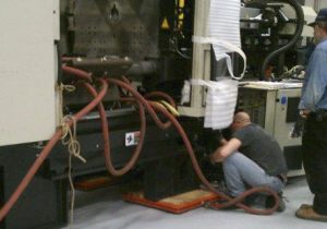 BAC technician at work on Energizer Schick machinery